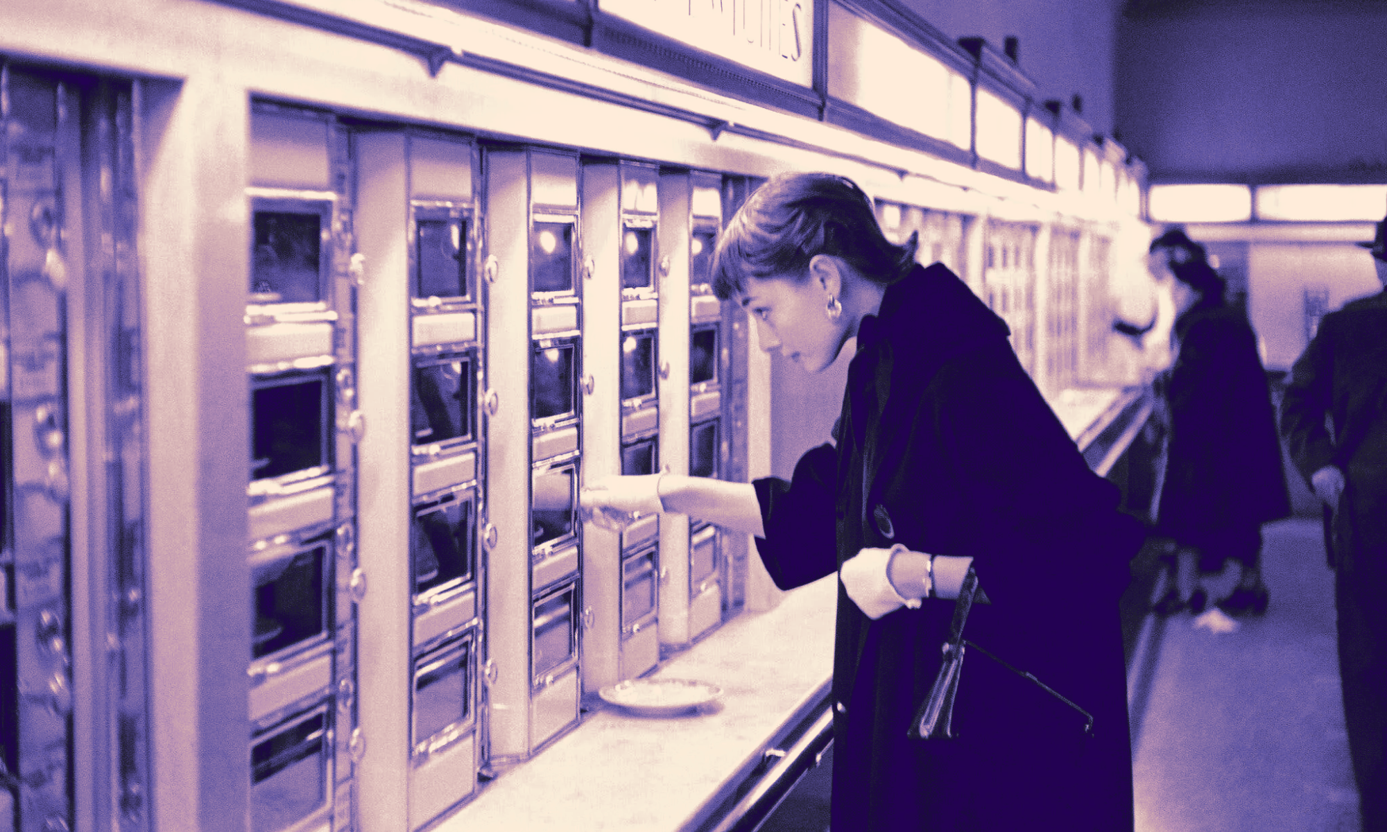 Vintage automat in which a woman chooses fresh food from a vending machine